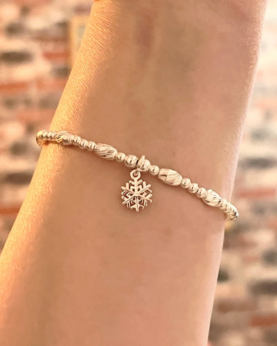 Crystal cut oval spacer bracelet with Snowflake charm