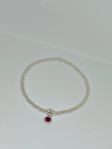 Sterling silver with Fuschia crystal charm