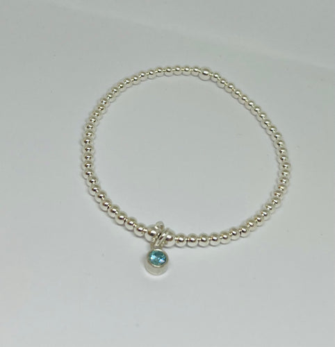 Sterling silver with aquamarine crystal charm