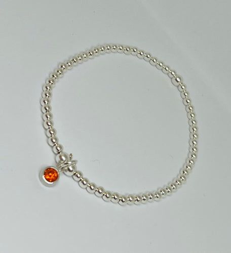 Sterling silver with orange crystal charm