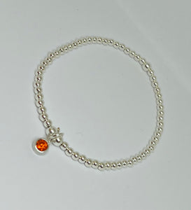 Sterling silver with orange crystal charm